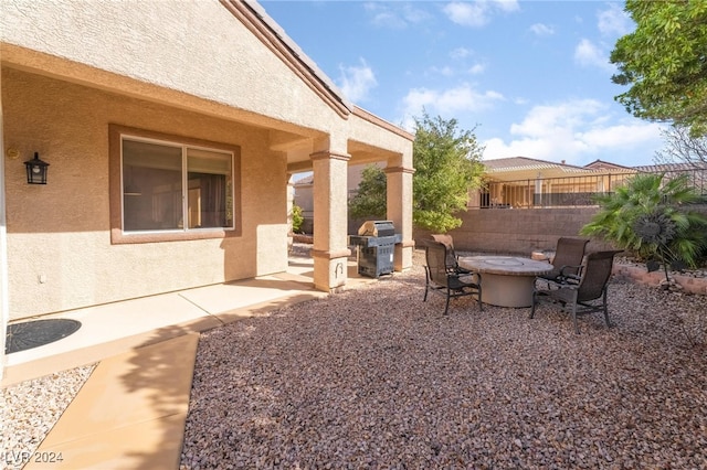 view of yard with a patio and an outdoor fire pit