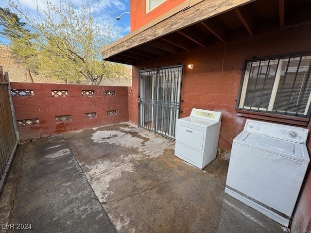 view of patio with washer and dryer