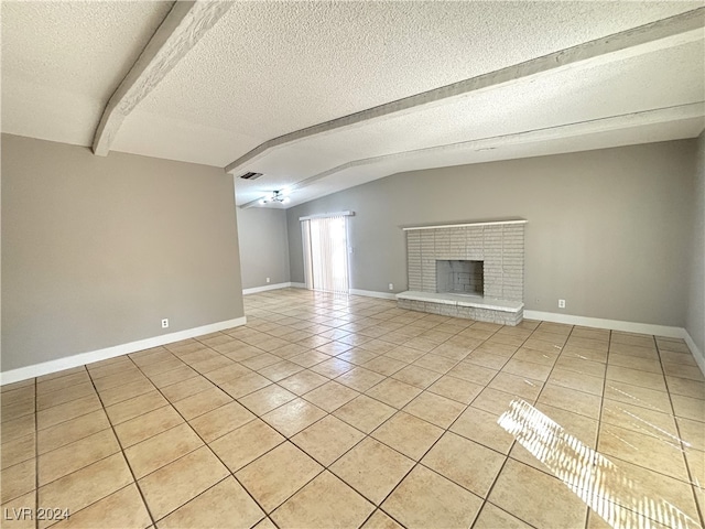 unfurnished living room featuring a fireplace, vaulted ceiling with beams, light tile patterned floors, and a textured ceiling