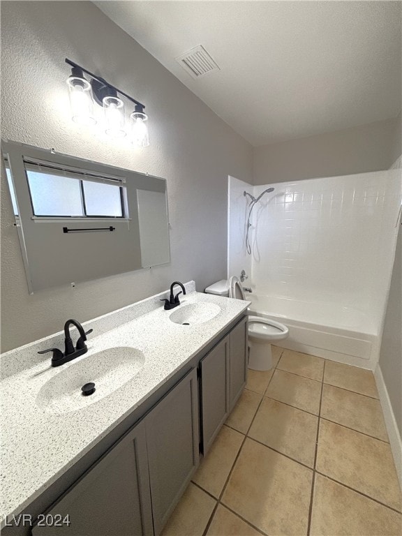 full bathroom featuring vanity, tile patterned flooring, toilet, and washtub / shower combination