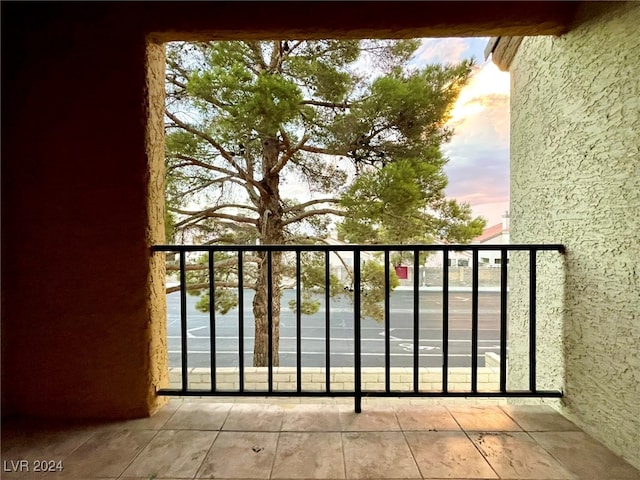 view of balcony at dusk