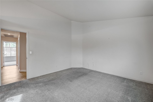 spare room with wood-type flooring