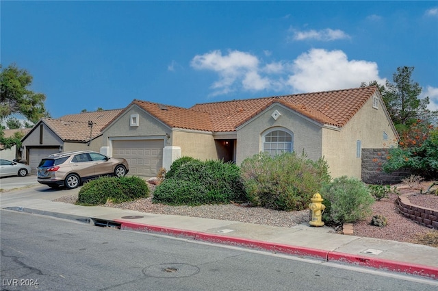 view of front of property with a garage