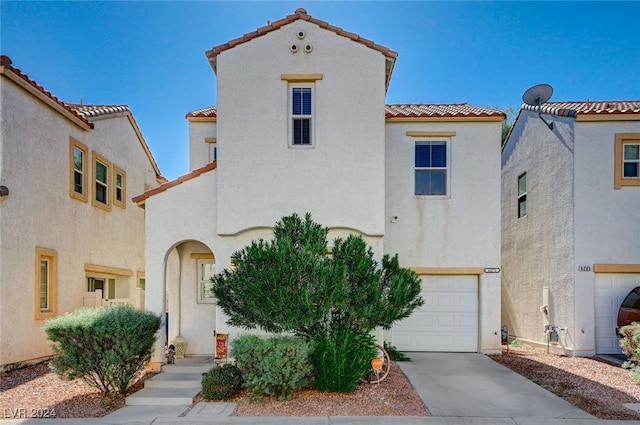 mediterranean / spanish-style house featuring a garage