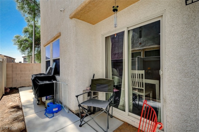 view of patio featuring fence