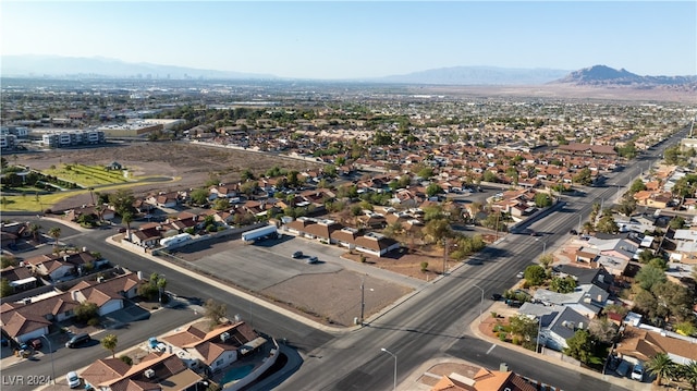 birds eye view of property with a mountain view