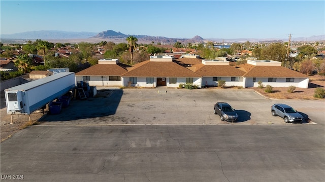 birds eye view of property with a mountain view