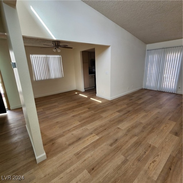 interior space with ceiling fan and light hardwood / wood-style flooring