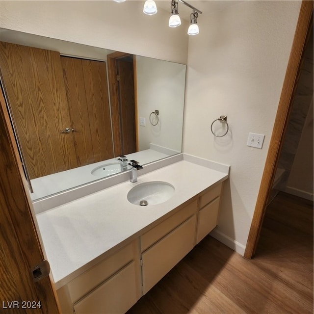 bathroom featuring vanity and hardwood / wood-style flooring