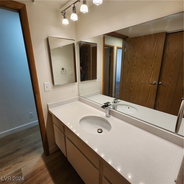 bathroom featuring wood-type flooring and vanity