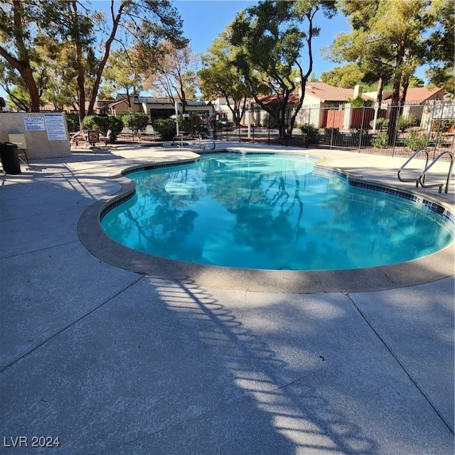 view of swimming pool featuring a patio area