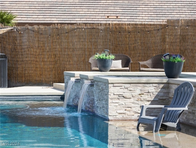 view of patio / terrace featuring pool water feature