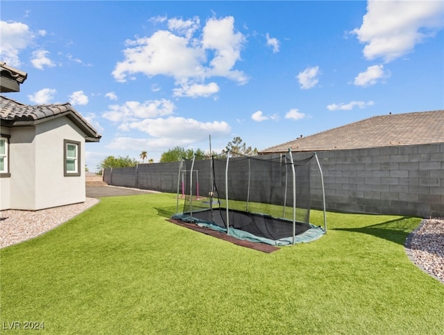 view of yard with a trampoline