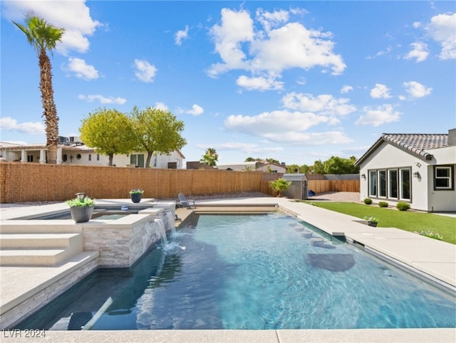 view of swimming pool with pool water feature