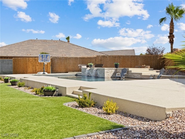 view of swimming pool featuring a yard and pool water feature