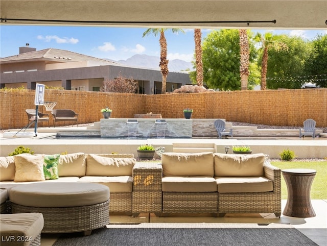 exterior space with a mountain view and an outdoor living space