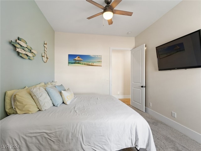 bedroom with ceiling fan and carpet floors