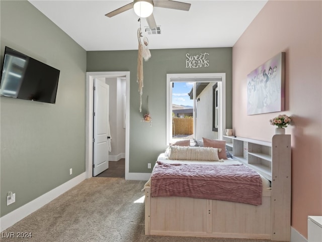 carpeted bedroom featuring ceiling fan