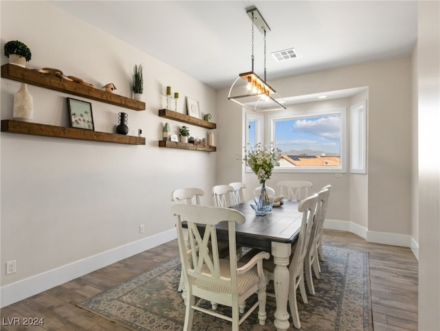 dining space featuring dark hardwood / wood-style floors