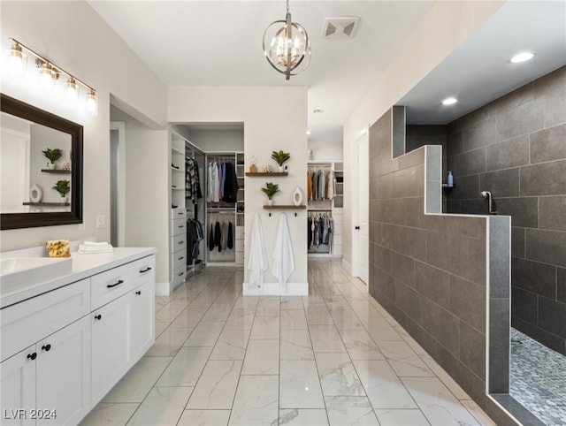 bathroom featuring tile walls, vanity, and a shower