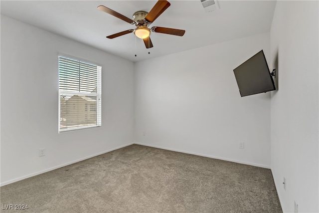 empty room with light carpet and ceiling fan