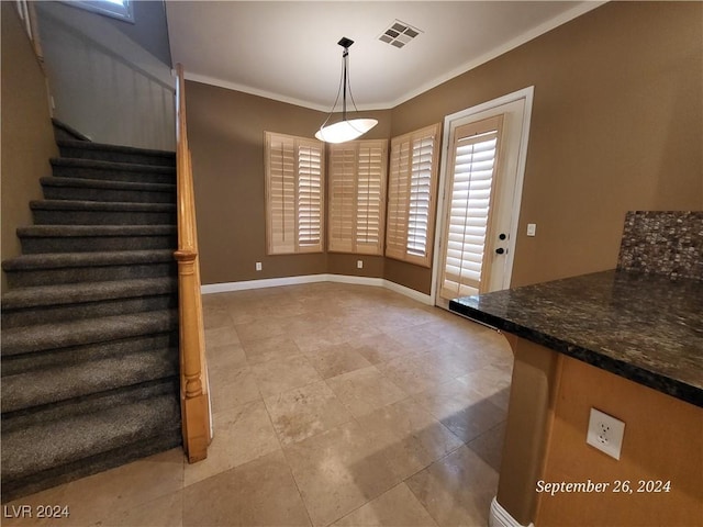1337 Via Savona Dr, Henderson, NV 89052 - unfurnished dining area with stairway, ornamental molding, baseboards, and light tile patterned floors