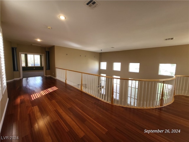 unfurnished room with dark hardwood / wood-style floors