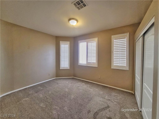 1337 Via Savona Dr, Henderson, NV 89052 - unfurnished bedroom with carpet, a closet, and baseboards