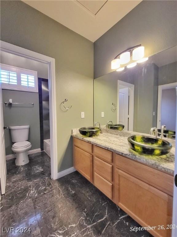 1337 Via Savona Dr, Henderson, NV 89052 - full bath with toilet, vanity, marble finish flooring, baseboards, and a tub