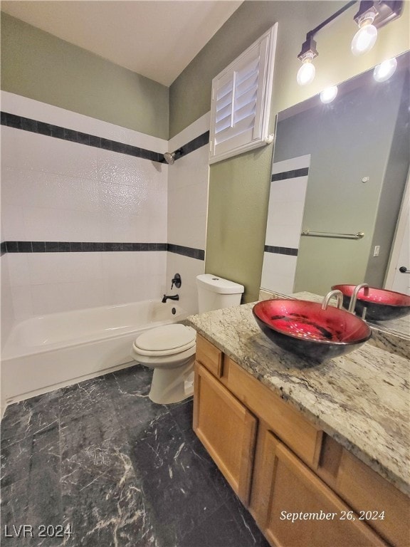 full bathroom with shower / bath combination, vanity, and toilet