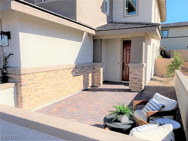 entrance to property with a patio area