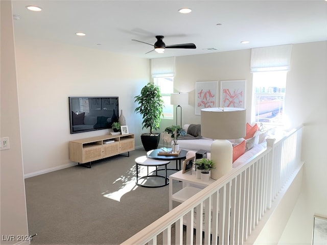 living room with carpet flooring and ceiling fan