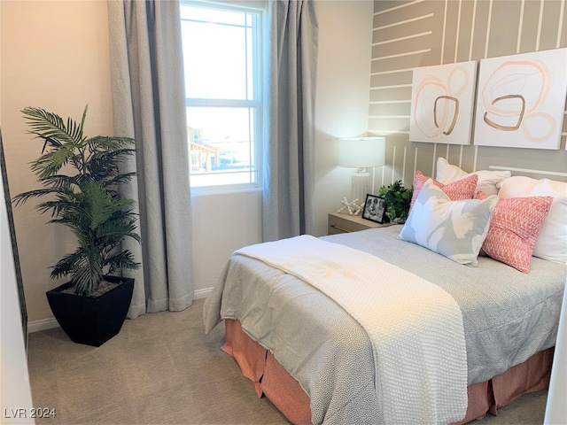 bedroom with multiple windows and carpet floors