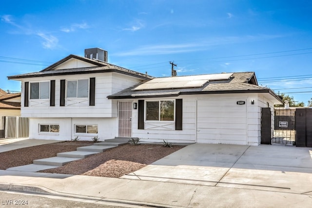 split level home with a garage