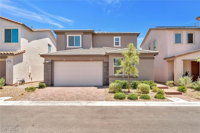 view of front of property with a garage