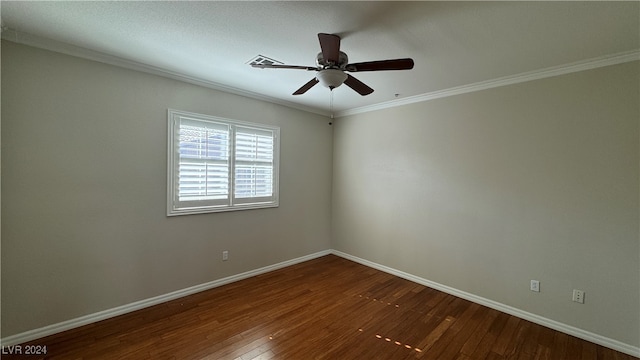 spare room featuring ceiling fan, ornamental molding, and dark hardwood / wood-style flooring