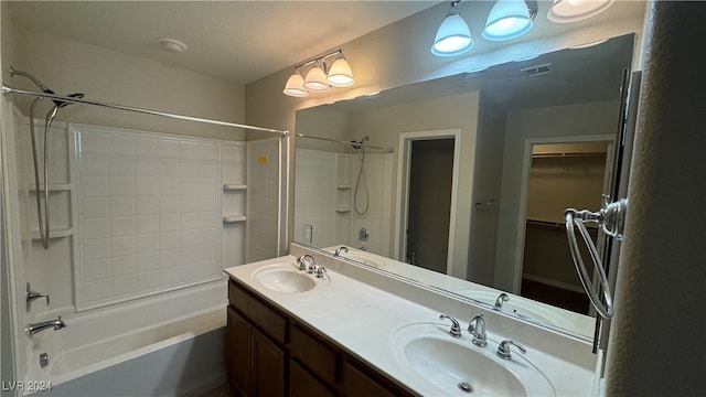 bathroom featuring shower / tub combination and vanity