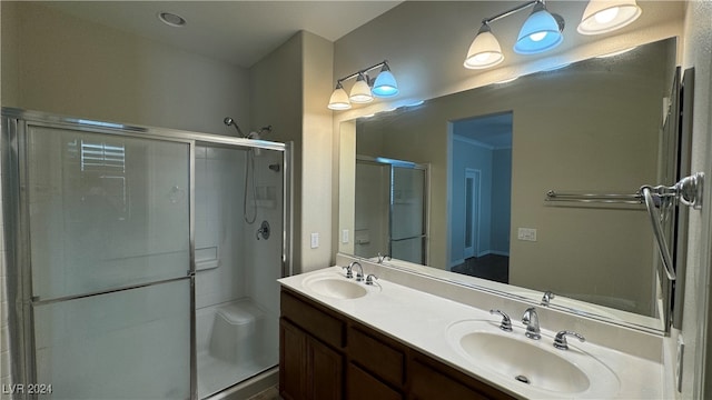 bathroom featuring vanity and a shower with shower door