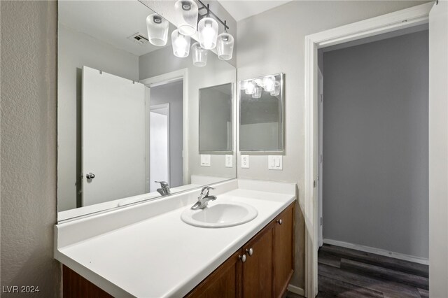 bathroom with vanity and wood-type flooring