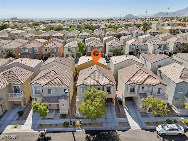 birds eye view of property with a mountain view