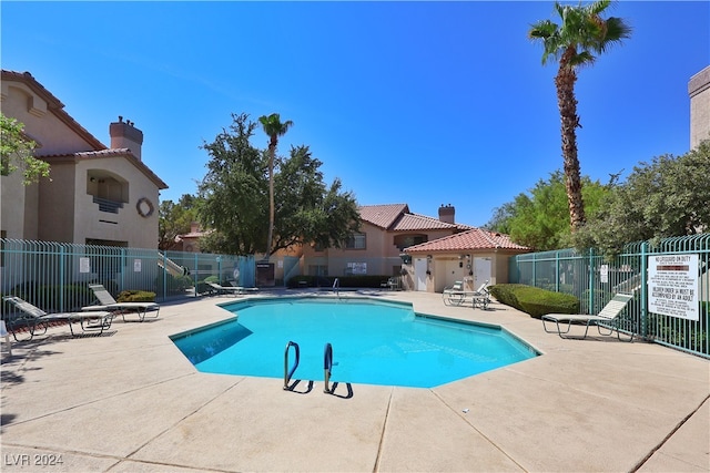 view of swimming pool with a patio