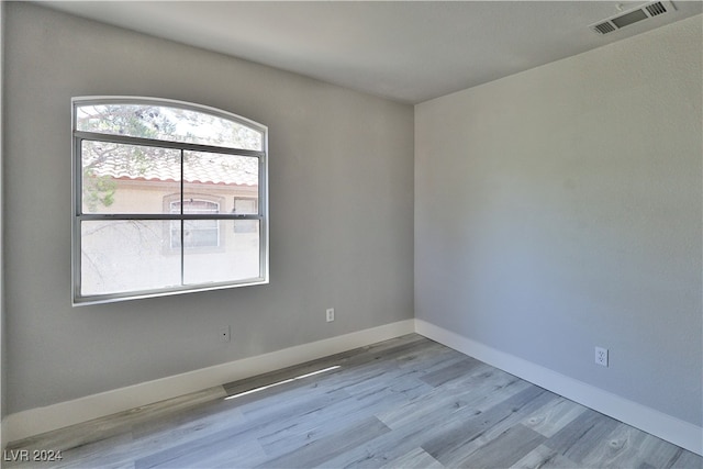 spare room featuring light wood-type flooring