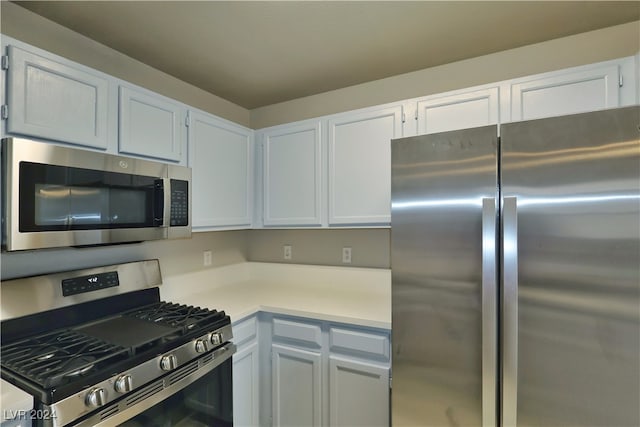 kitchen with white cabinets and stainless steel appliances