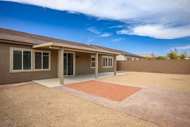 rear view of house featuring a patio