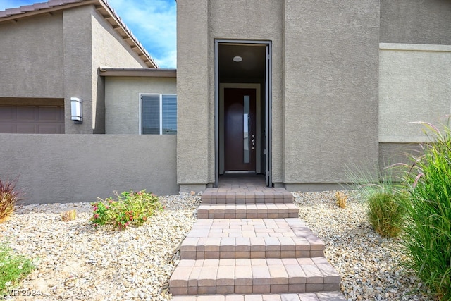 entrance to property featuring a garage