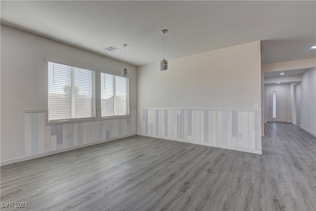 unfurnished room with light hardwood / wood-style floors