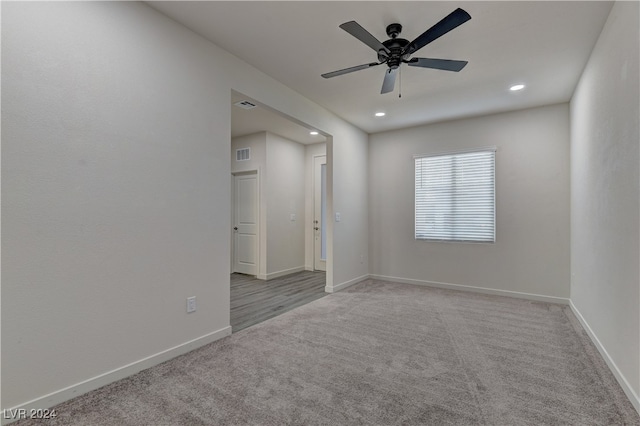 carpeted empty room featuring ceiling fan