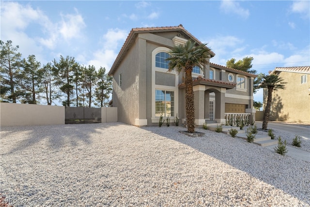 mediterranean / spanish house featuring a garage