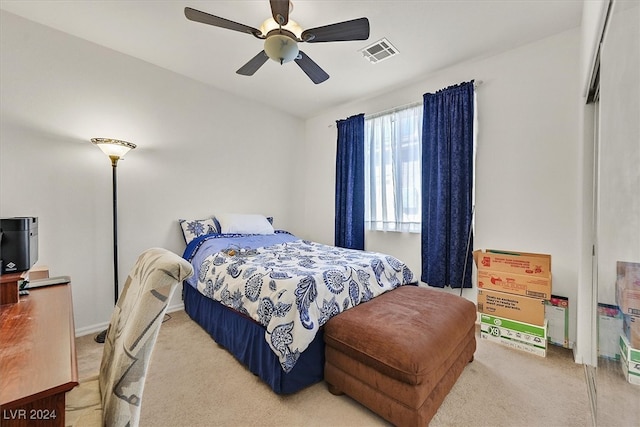 carpeted bedroom featuring ceiling fan