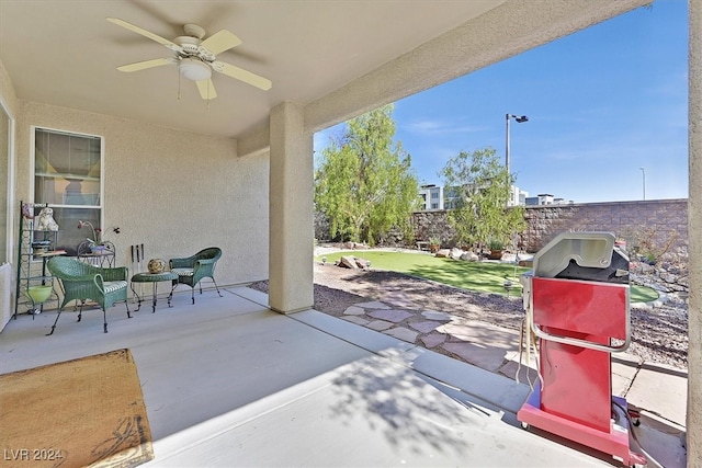 view of patio / terrace featuring ceiling fan and a grill